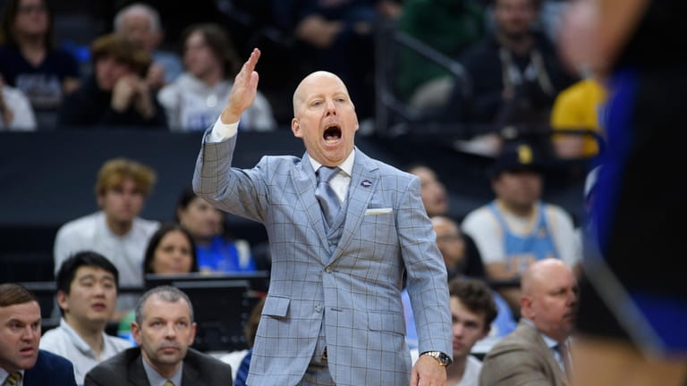 UCLA coach Mick Cronin shouts instructions from the bench during...