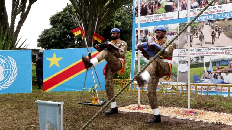 United Nations peacekeepers from Pakistan participate in a handover ceremony...