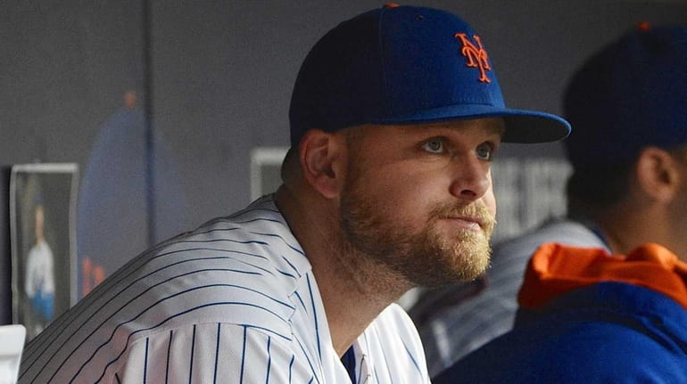 New York Mets first baseman Lucas Duda looks on from...