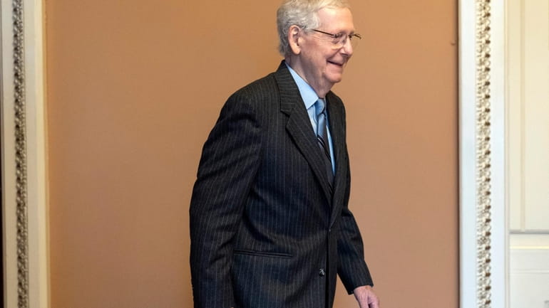 Senate Minority Leader Mitch McConnell of Ky., leaves a Republican...