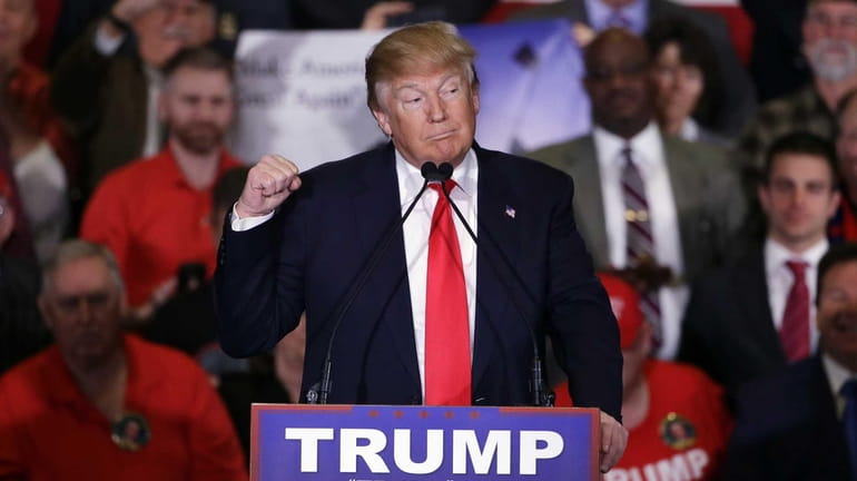 Republican presidential candidate Donald Trump makes a point during a...