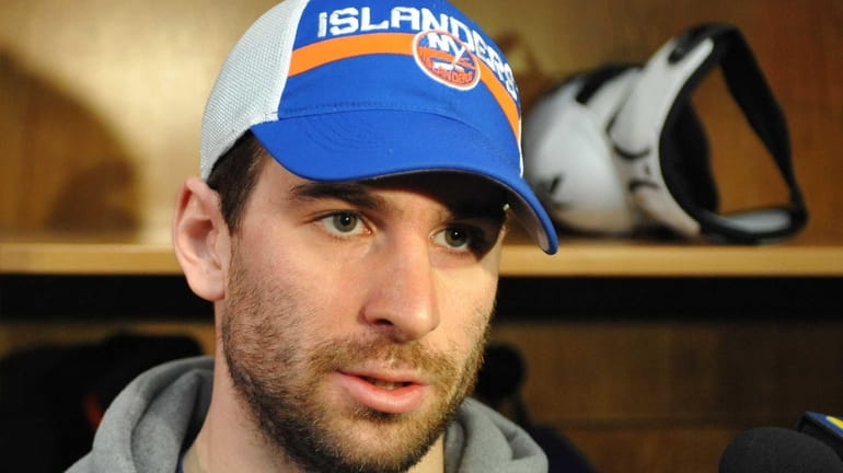 John Tavares #91 of the New York Islanders speaks with...