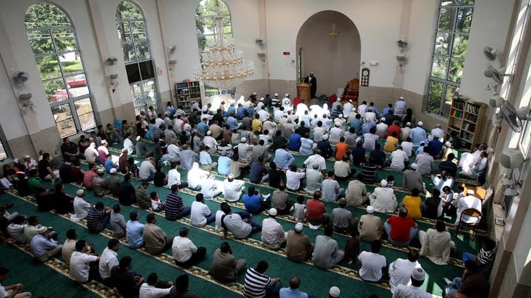People pray at the Masqid Darul Quran mosque in Bay...