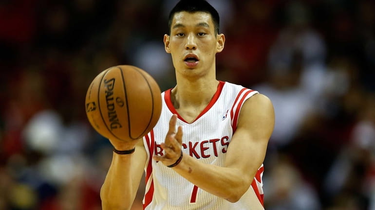 Houston Rockets guard Jeremy Lin passes the ball during a...