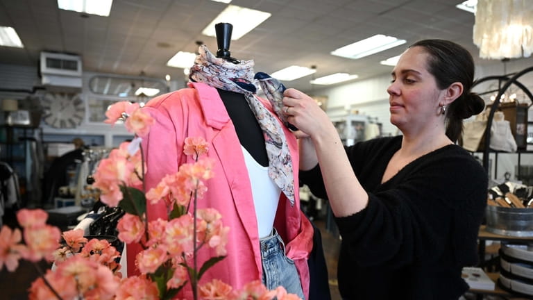 Danielle Frey, brand manager at Madison’s Niche, preps a new...