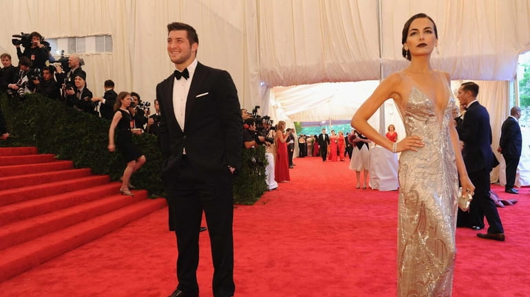 New York Jet Tim Tebow and actress Camilla Belle attend...