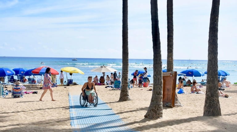 Beaches in Hawaii have mats that allow wheelchair users to...