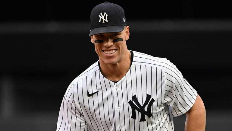 Yankees rightfielder Aaron Judge runs in from the outfield against...
