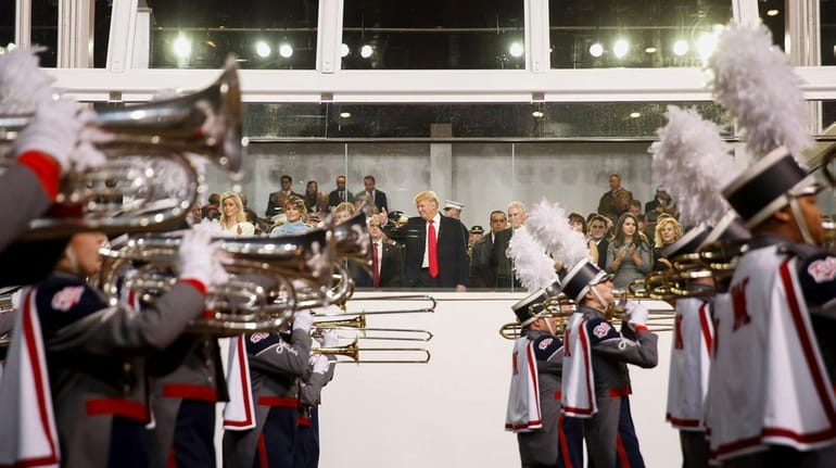 President Donald Trump loves a parade. Here, he watches his...