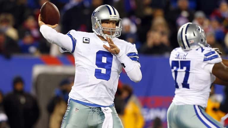 Tony Romo #9 of the Dallas Cowboys throws a pass...