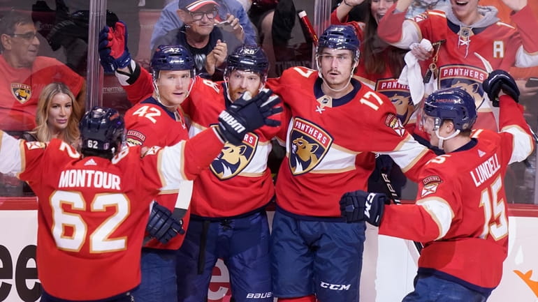 Florida Panthers teammates celebrate a goal by Florida Panthers left...