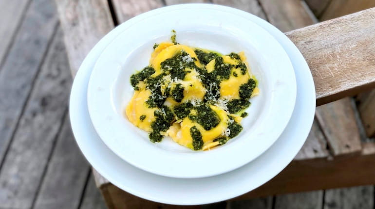 Cheese ravioli with green sauce -- all made by Crab...