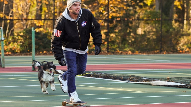 Jon Virga, of Sayville, skates loops around the tennis courts...