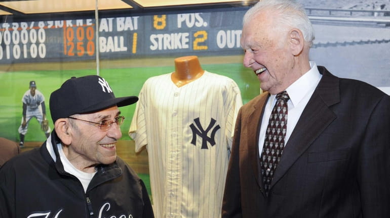 Yogi Berra, a Hall of Fame catcher who played for...