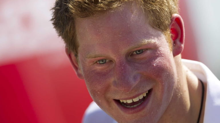 Britain's Prince Harry, smiles after playing rugby at Flamengo Beach...