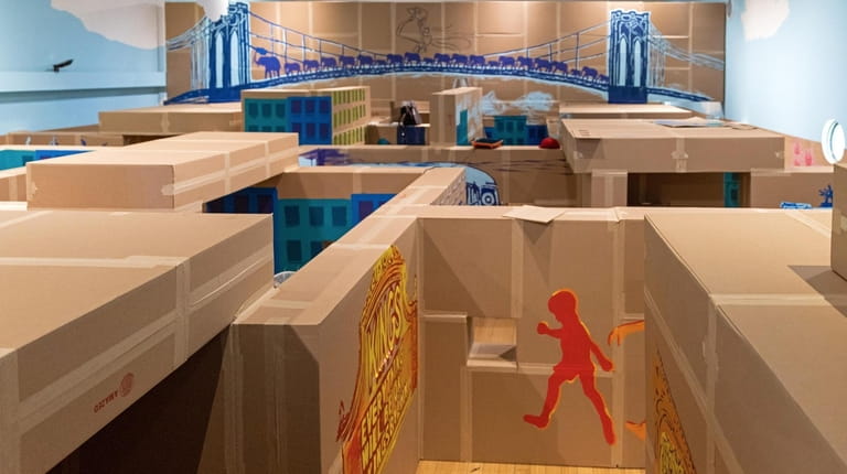 A view overlooking the "A-MAZE-D" life-size cardboard maze, an exhibit...