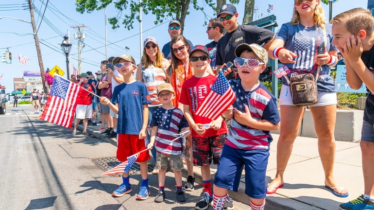People watch the Independence Day parade in Port Jefferson.