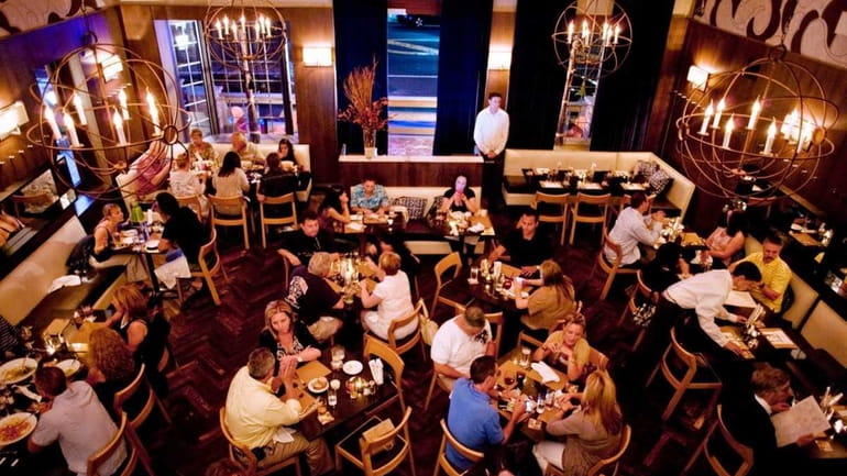 The ground-floor eating area at Verace is in a warm...