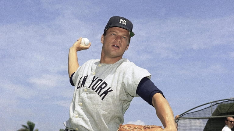 Jim Bouton, pitcher for the New York Yankees pitching in...