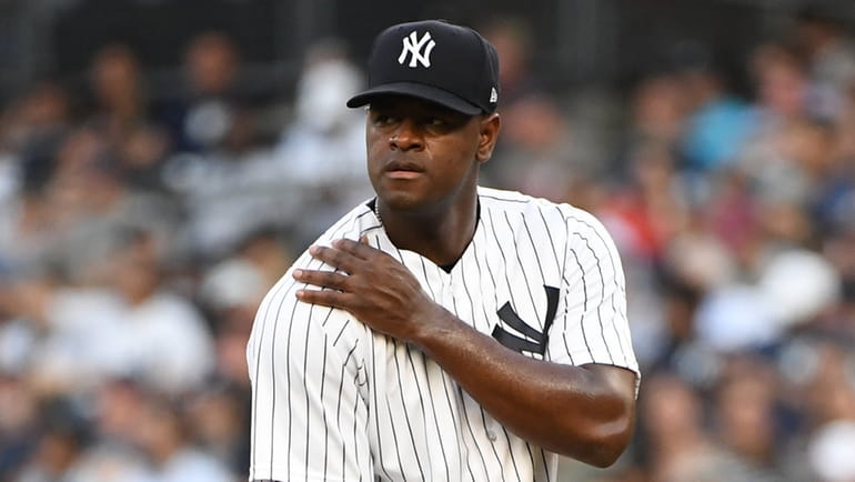 Yankees starting pitcher Luis Severino stands on the mound against...