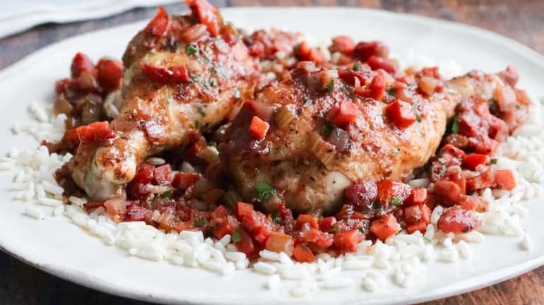 Chicken drumsticks braised in tomato and red wine.