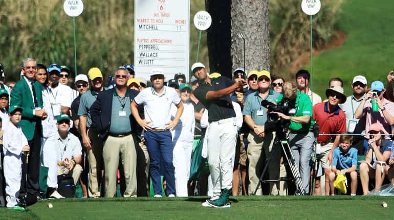 Tony Finau of the United States plays a shot during...