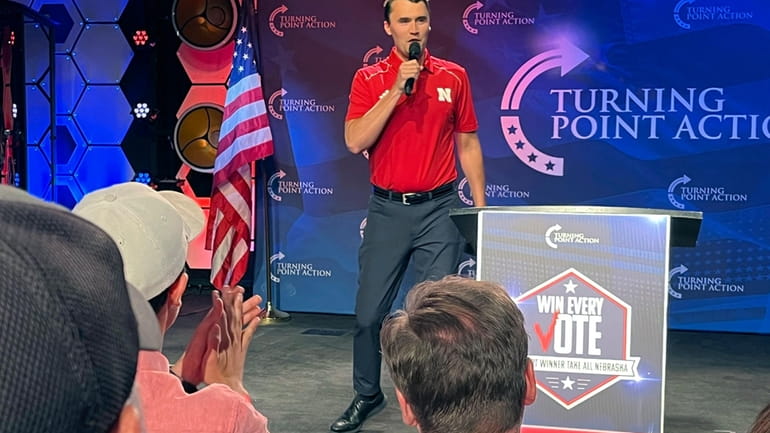 Conservative activist Charlie Kirk takes the stage before a rally...