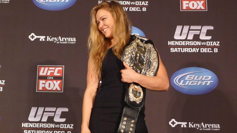 Ronda Rousey shows off her new UFC bantamweight championship belt...
