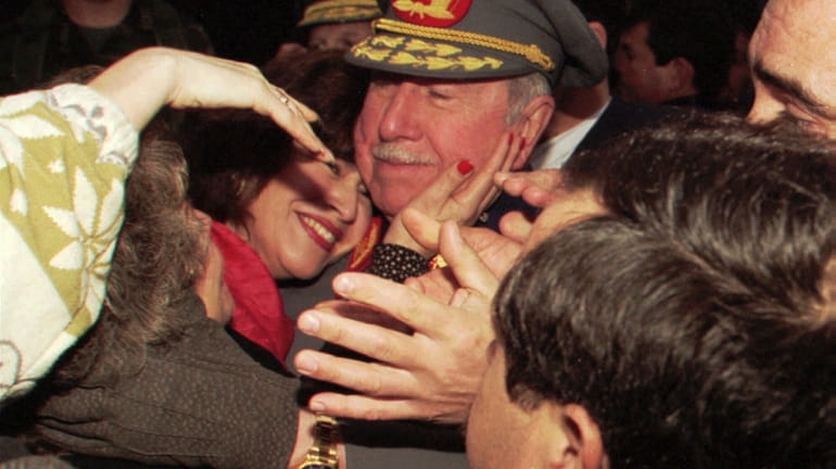 Former Chilean dictator and then-military commander Gen. Augusto Pinochet is...