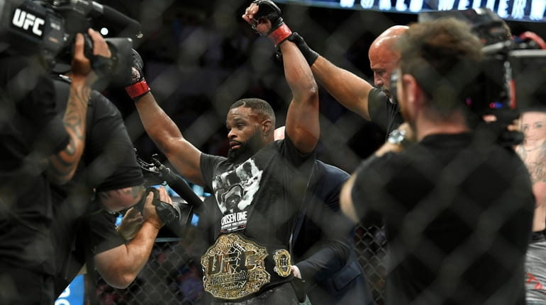 Tyron Woodley is acknowledged as the winner after his victory...