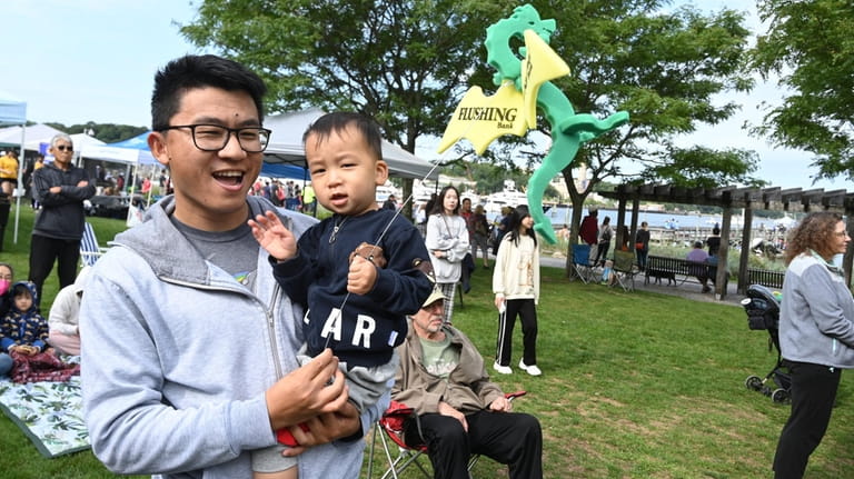 Daryl Yang with his son Jasper, 2, attend the Eighth...