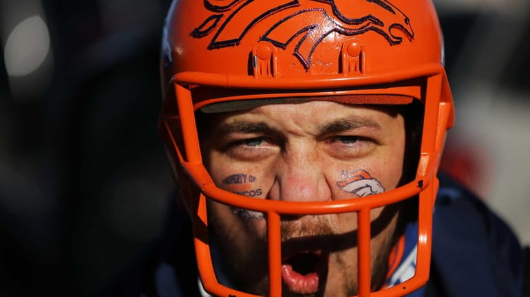 Denver Broncos fan Stan Parker of Greeley, Colo., prepares for...