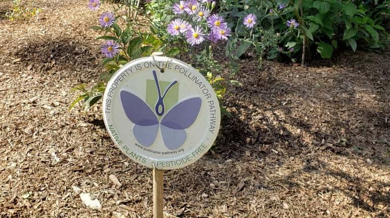 Gardeners who participate in Pollinator Pathways can purchase medallion signs...