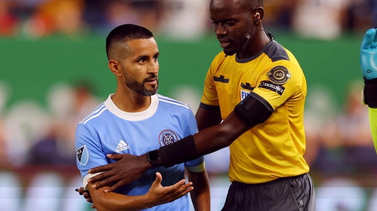 Maxi Moralez #10 of NYCFC has words with goalkeeper Julio...