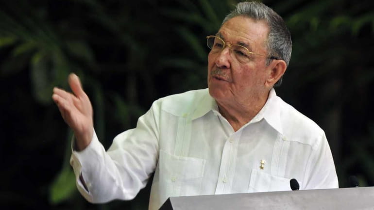 Cuban President Raul Castro gestures as he delivers a speech...
