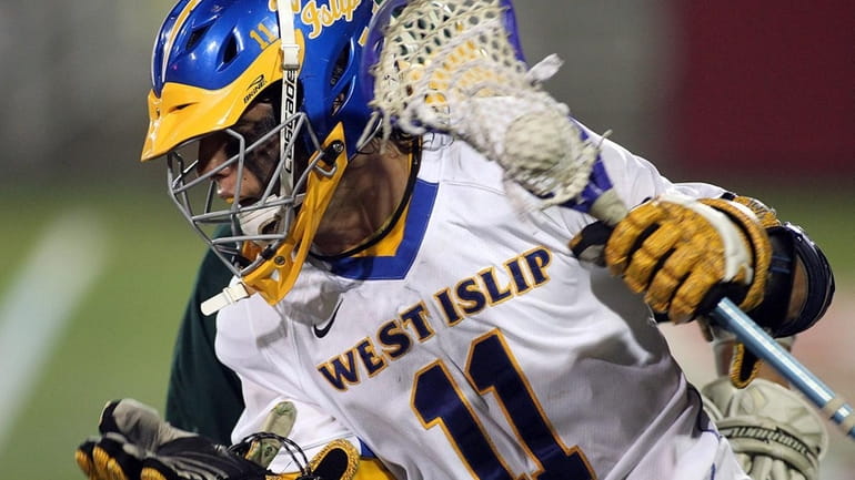 West Islip's Andrew Hodgson (11) drives to the front of...