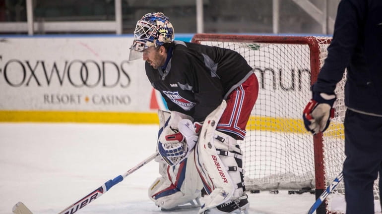 Henrik Lundqvist stands in the net during Rangers training camp...