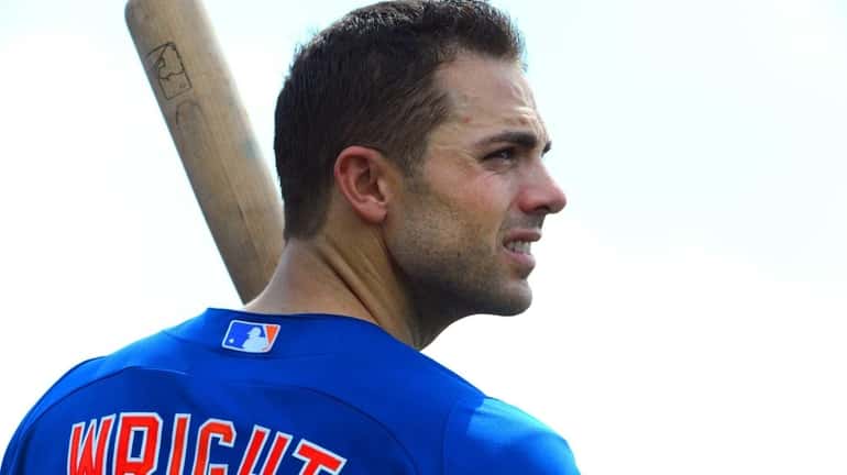 David Wright looks on during a spring training workout at...