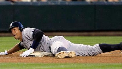 New York Yankees' Alex Rodriguez sprawls across third base after...