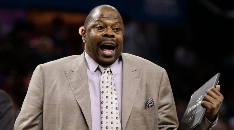 Charlotte Hornets assistant coach Patrick Ewing argues a call during...