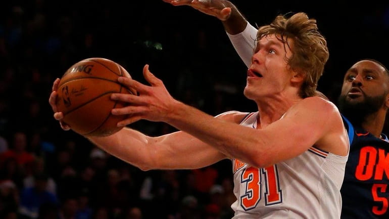 Ron Baker #31 of the New York Knicks goes to...
