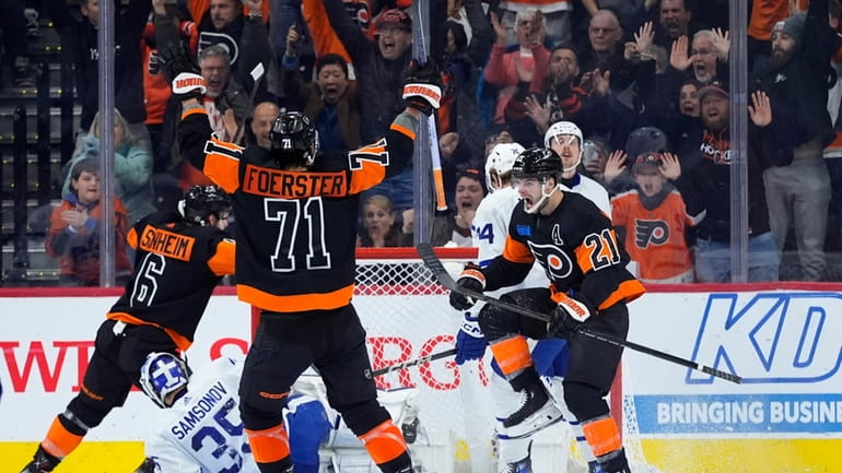 Philadelphia Flyers' Scott Laughton (21) celebrates after scoring a goal...
