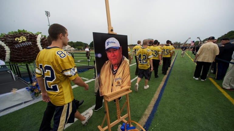 At the memorial service for football coach Howard Vogts, who...