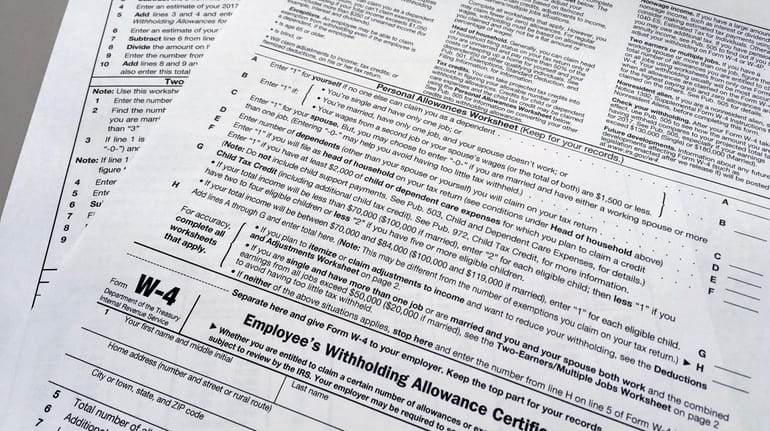 This photo shows an IRS W-4 form on Feb. 1, 2018 in...