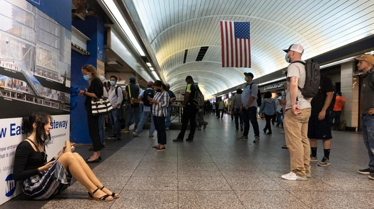 Long Island Rail Road passengers waited Tuesday in Penn Station...