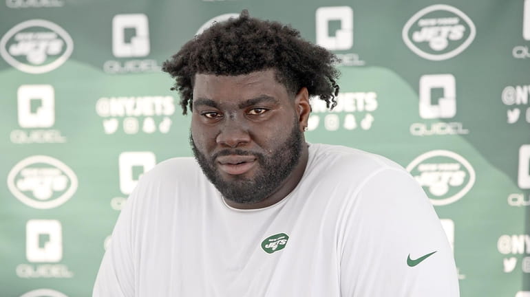 Jets' Mekhi Becton talks to press at the Jets camp in...