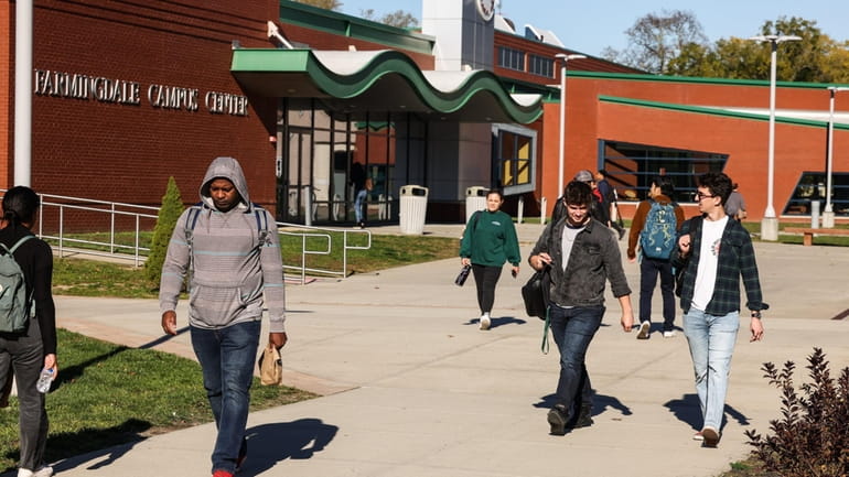 Students walk the campus of Farmingdale State College on Nov. 3. Farmingdale,...