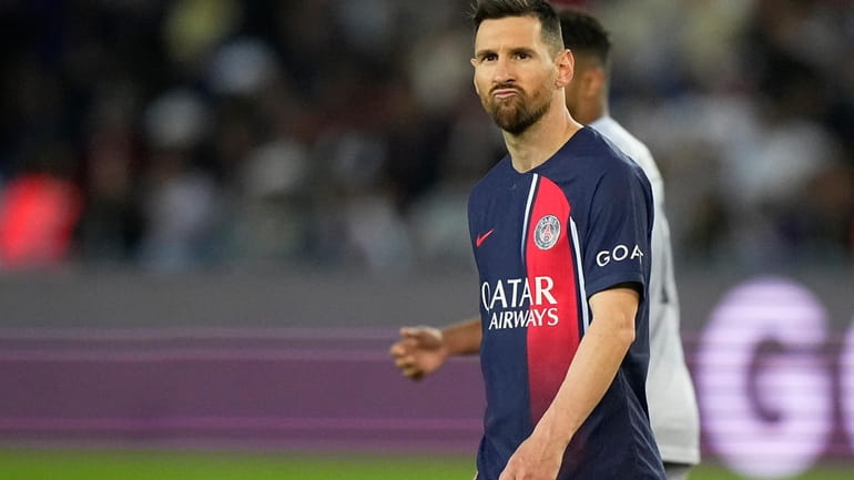 PSG's Lionel Messi grimaces during the French League One soccer...