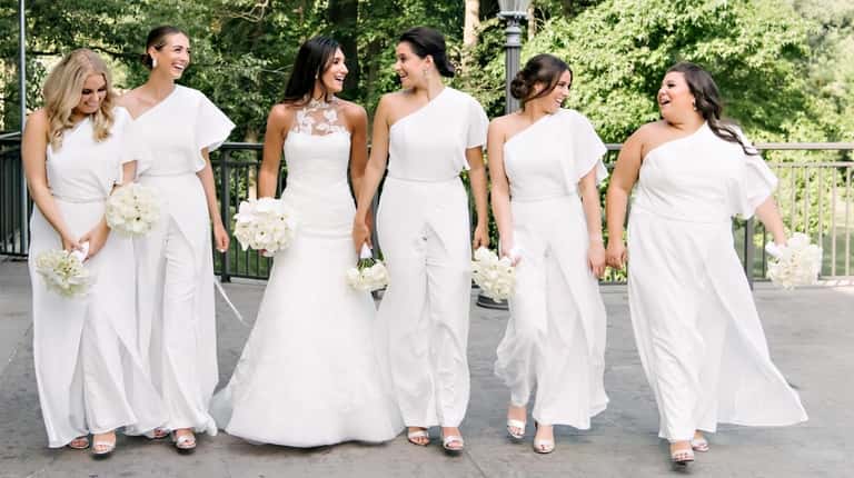 The bridesmaids wore jumpsuits with an overlay at former Merrick...