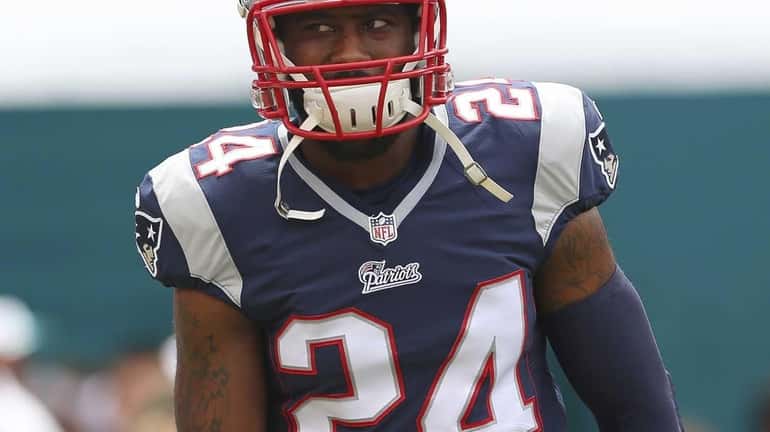 Darrelle Revis #24 of the New England Patriots stands on...
